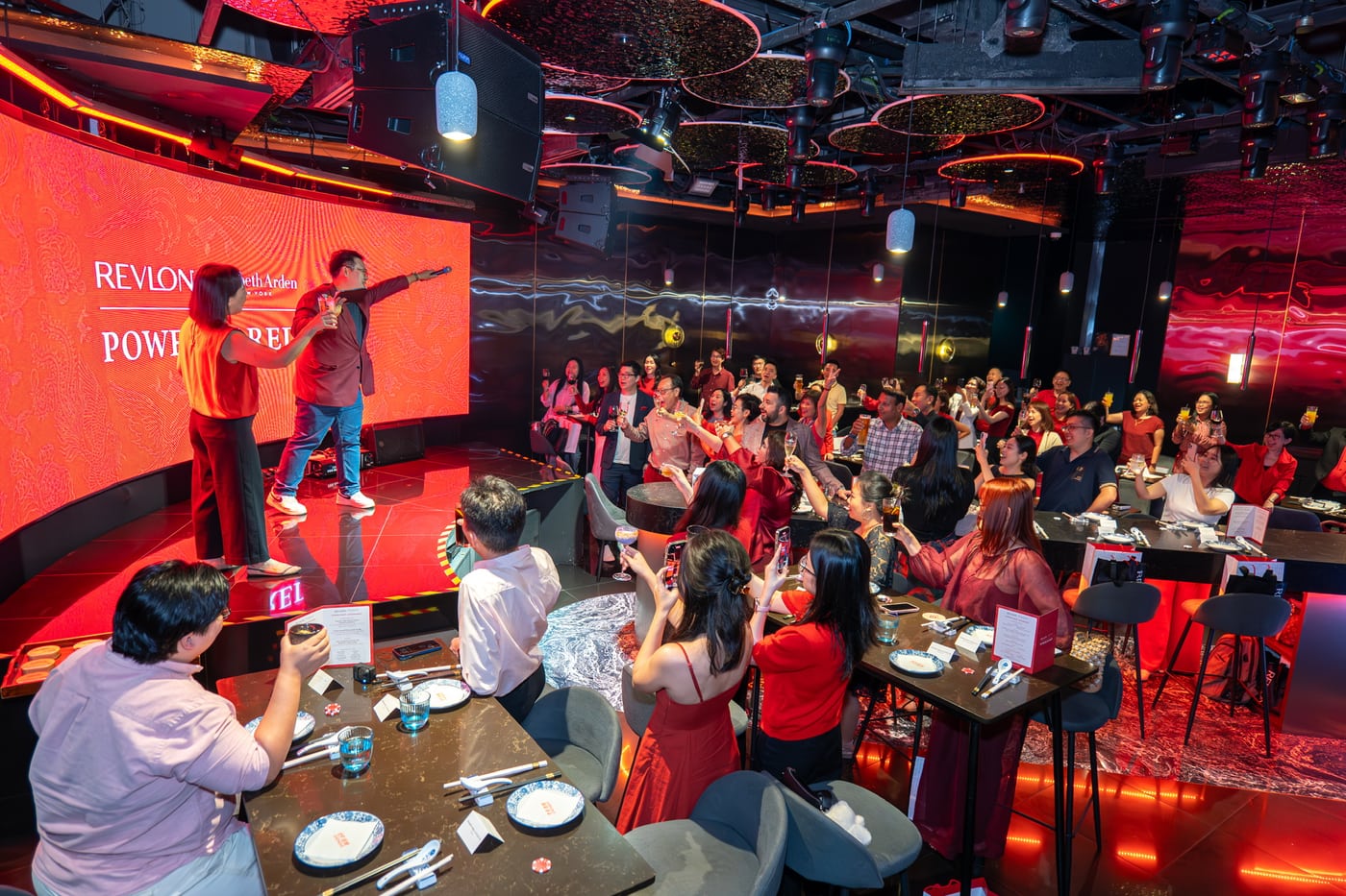 Emcee Dixon working a lively company dinner and dance crowd in Singapore