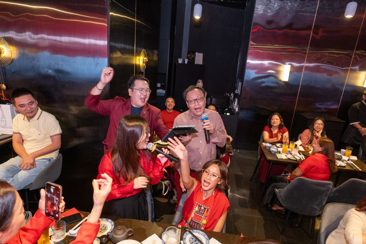 Emcee Dixon celebrating with guests at a corporate night in Singapore
