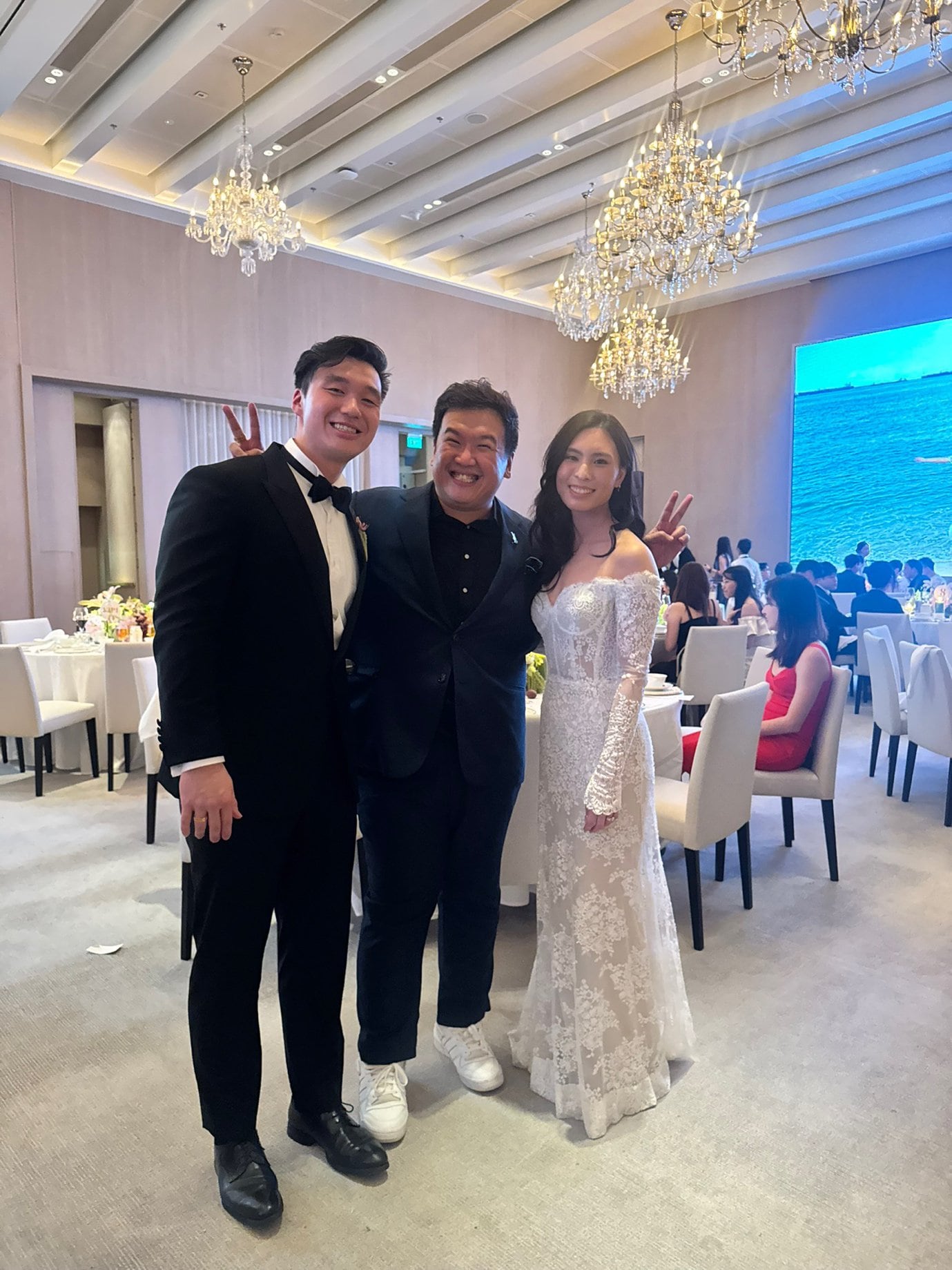 Emcee Dixon celebrating with a bride and groom at a Singapore wedding