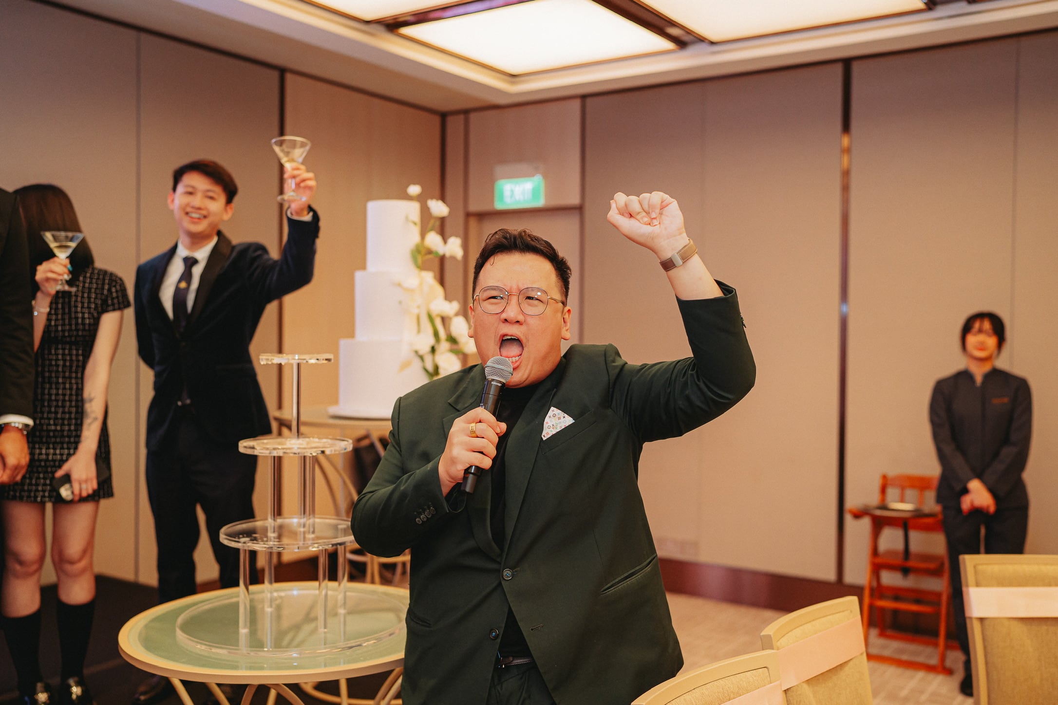Emcee Dixon leading a lively toast at a Singapore wedding