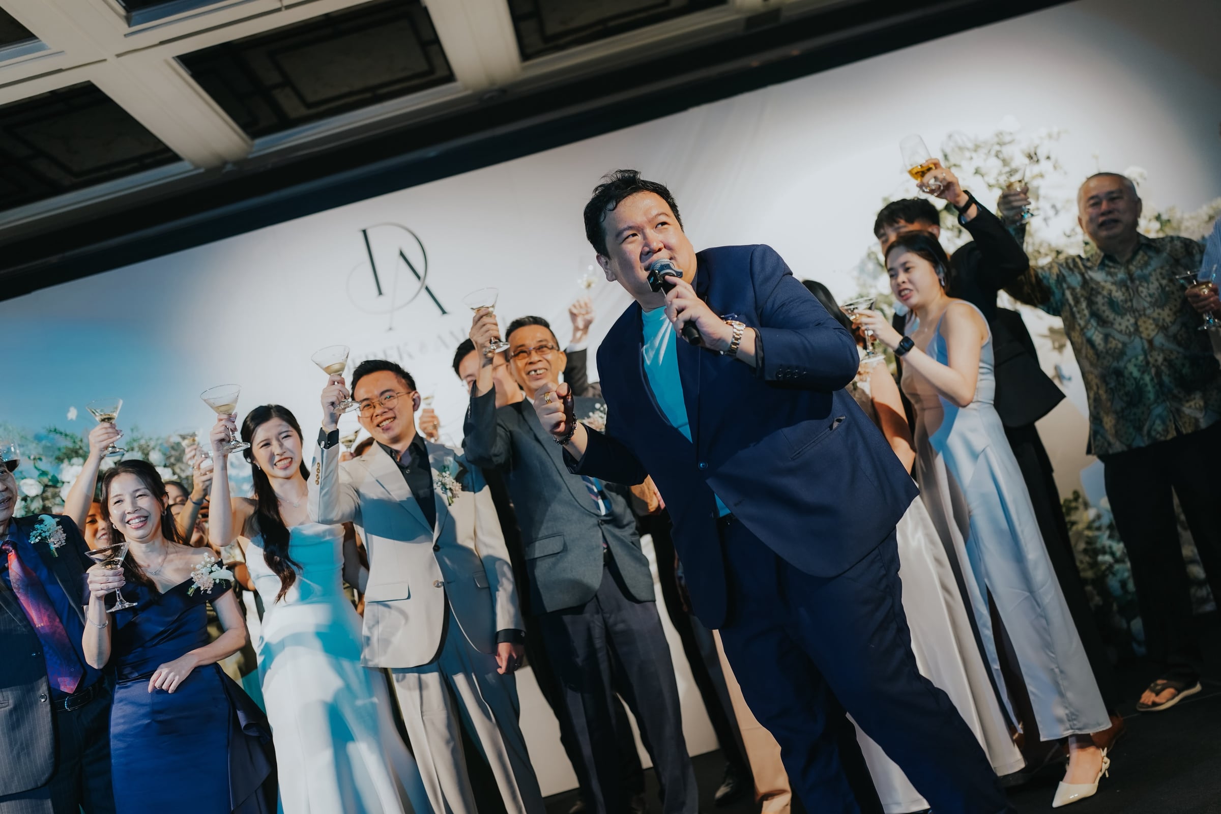 Emcee Dixon leading a champagne toast at a Singapore wedding